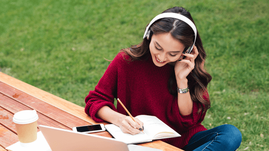 Asian Girl in Headphones Studying