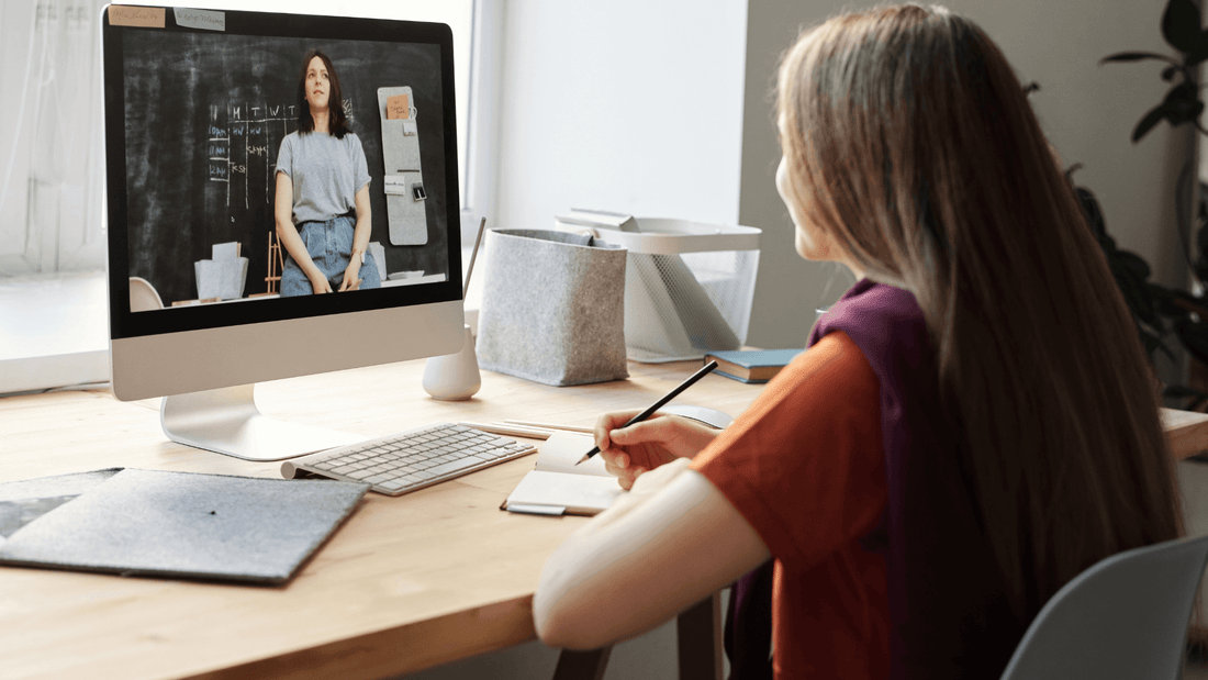 Student attending an online TEF Canada exam preparation coaching session via computer.