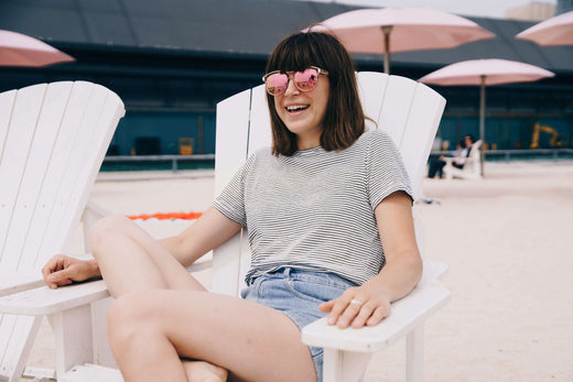 A woman in a beach chair smiling - Tumu Learning