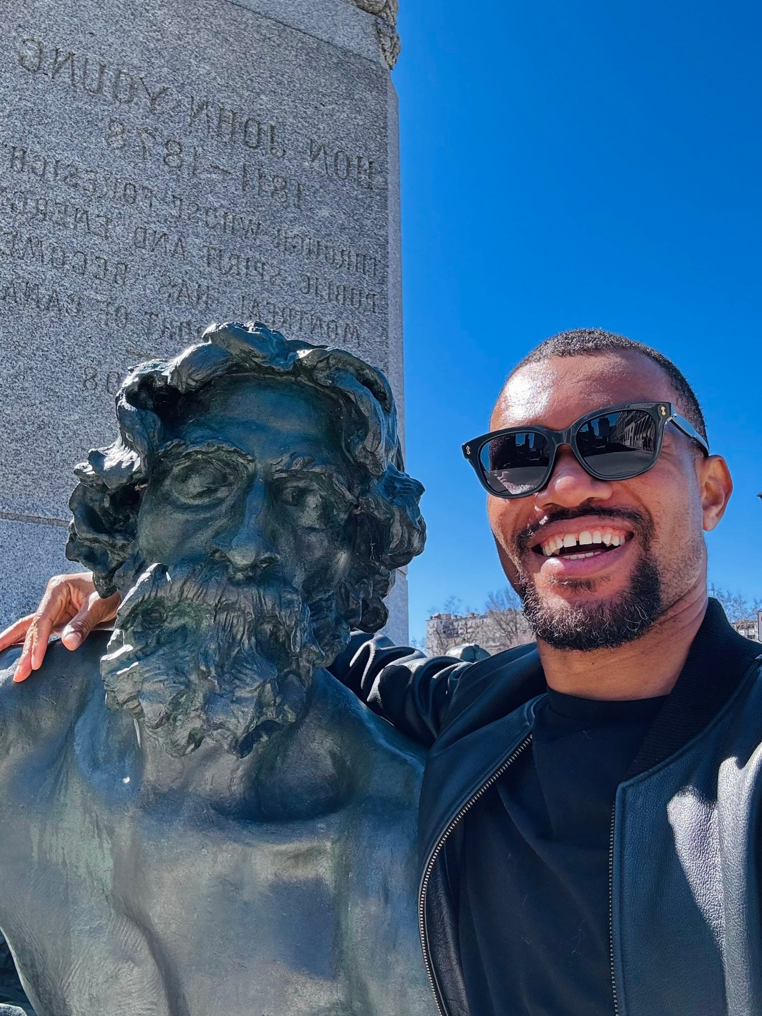 French student David with a sculpture in Montreal
